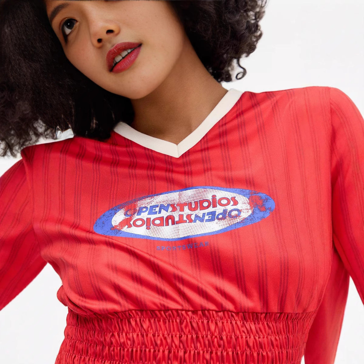 Damen Sportliches Crop-Top mit elastischem Smocking und modernen Grafikdetails WOLFF
